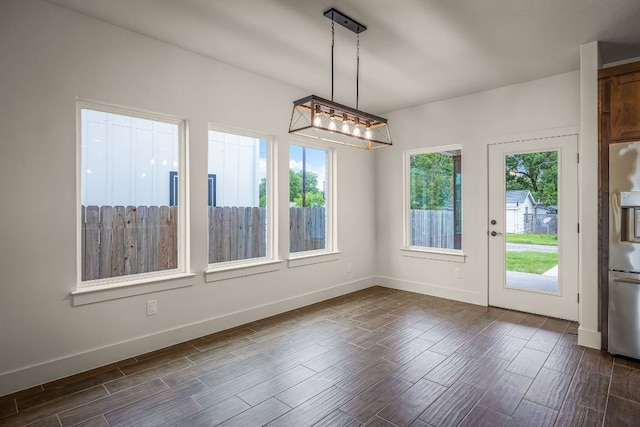 182 W Torrey St, New Braunfels, TX 78130 - unfurnished dining area featuring dark wood-style floors and baseboards