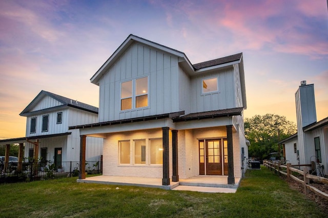 182 W Torrey St, New Braunfels, TX 78130 - back of property featuring board and batten siding, a patio, and brick siding