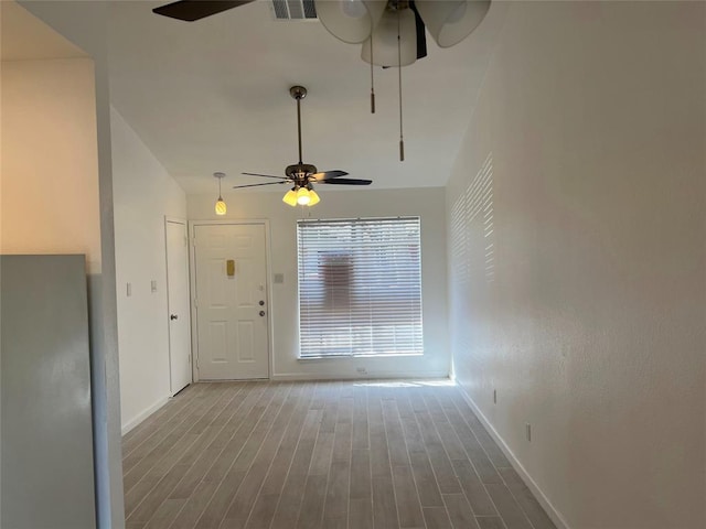 1015 E Yager Ln Unit 77, Austin, TX 78753 - unfurnished living room with a ceiling fan and wood finished floors