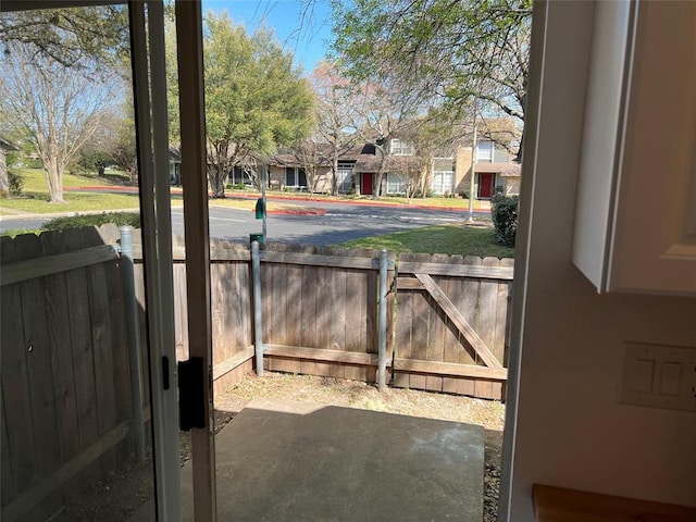1015 E Yager Ln Unit 77, Austin, TX 78753 - doorway featuring a residential view and unfinished concrete flooring