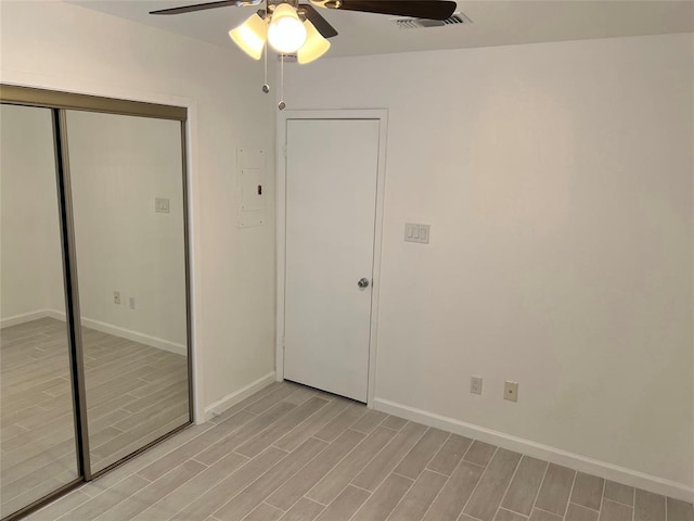 1015 E Yager Ln Unit 77, Austin, TX 78753 - unfurnished bedroom featuring light wood finished floors, a closet, and ceiling fan