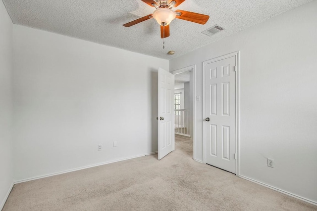 17516 Klamath Falls Dr, Round Rock, TX 78681 - unfurnished bedroom featuring a textured ceiling, carpet floors, and ceiling fan