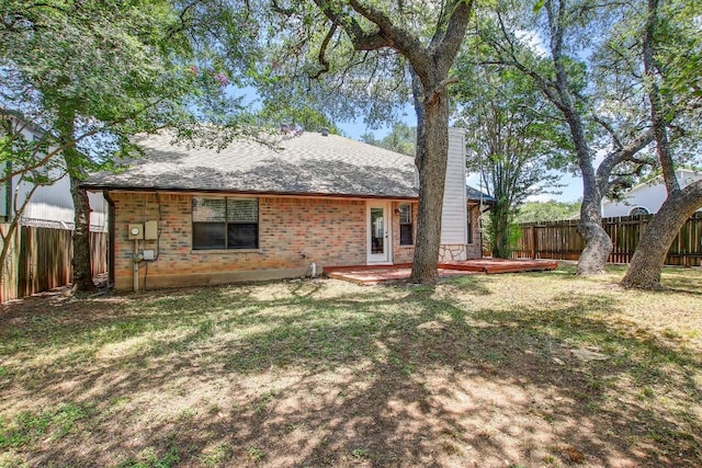 17516 Klamath Falls Dr, Round Rock, TX 78681 - back of house with a chimney, a fenced backyard, a deck, and brick siding