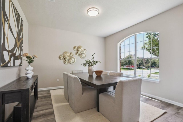 212 Boone Valley Dr, Round Rock, TX 78664 - dining area with baseboards and dark wood-style flooring