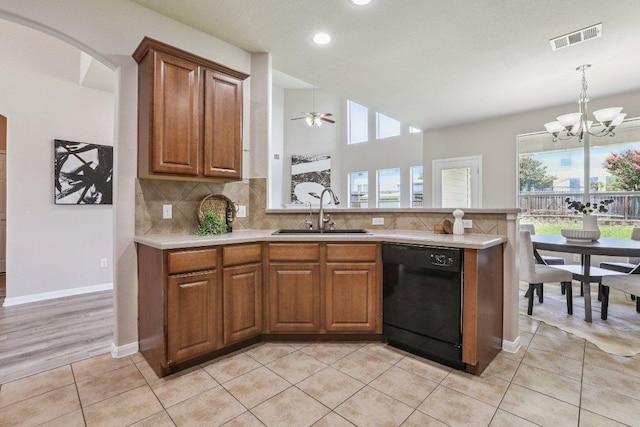 212 Boone Valley Dr, Round Rock, TX 78664 - kitchen with dishwasher, light countertops, brown cabinets, tasteful backsplash, and recessed lighting