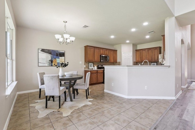 212 Boone Valley Dr, Round Rock, TX 78664 - dining space with a chandelier, recessed lighting, and light tile patterned flooring