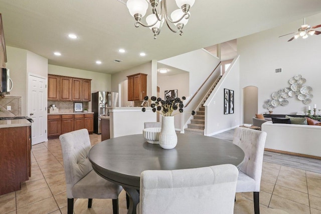 212 Boone Valley Dr, Round Rock, TX 78664 - dining space featuring light tile patterned floors, stairs, a chandelier, recessed lighting, and a ceiling fan