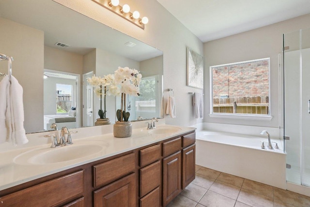 212 Boone Valley Dr, Round Rock, TX 78664 - bathroom featuring double vanity, a bath, and tile patterned floors