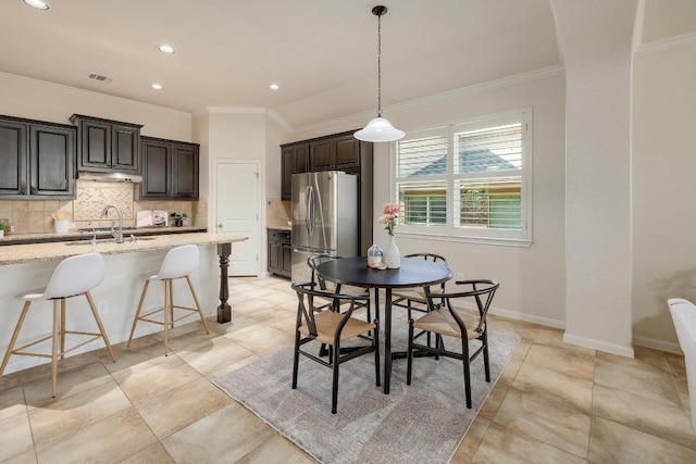 1200 Falling Hills Dr, Georgetown, TX 78628 - dining room featuring crown molding and recessed lighting