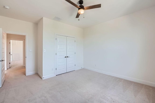 520 Germander Rd, Leander, TX 78641 - unfurnished bedroom featuring light colored carpet, a closet, and a ceiling fan