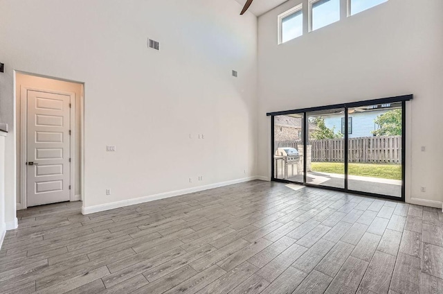 520 Germander Rd, Leander, TX 78641 - spare room featuring a high ceiling and wood finished floors