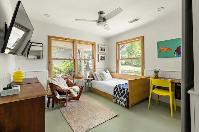5204 Cueva Dr, Austin, TX 78738 - bedroom with a wainscoted wall, finished concrete floors, and ceiling fan