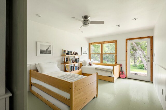 5204 Cueva Dr, Austin, TX 78738 - bedroom with access to outside, ceiling fan, and a wainscoted wall