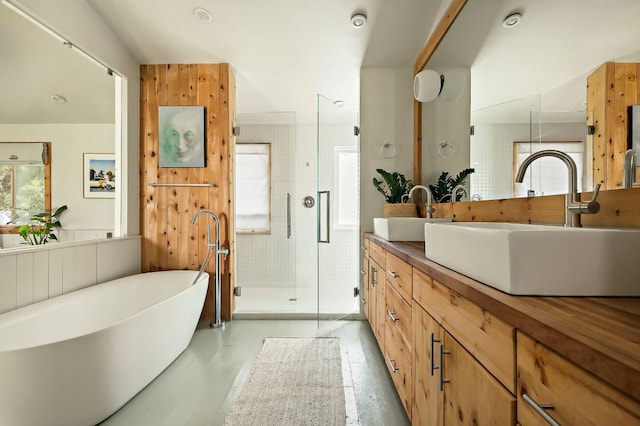 5204 Cueva Dr, Austin, TX 78738 - full bath featuring a shower stall, double vanity, and a freestanding bath