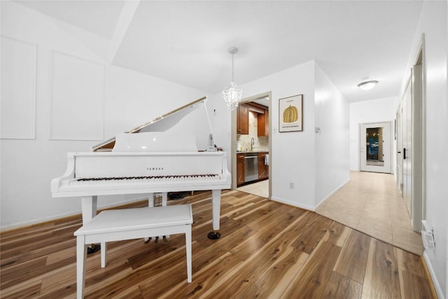 7162 Chimney Cors Unit 7204, Austin, TX 78731 - living area with light wood-style floors and a chandelier