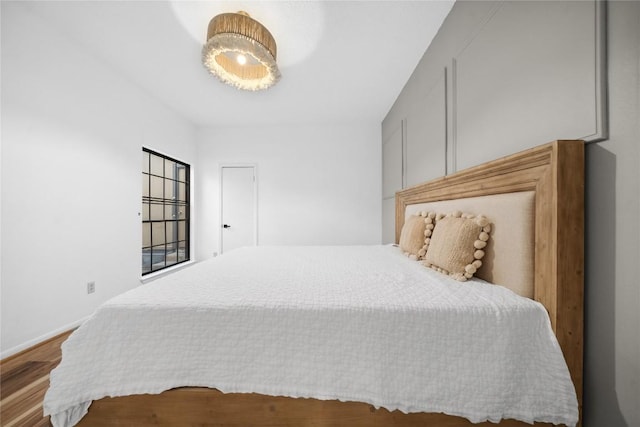 7162 Chimney Cors Unit 7204, Austin, TX 78731 - bedroom with wood finished floors and baseboards
