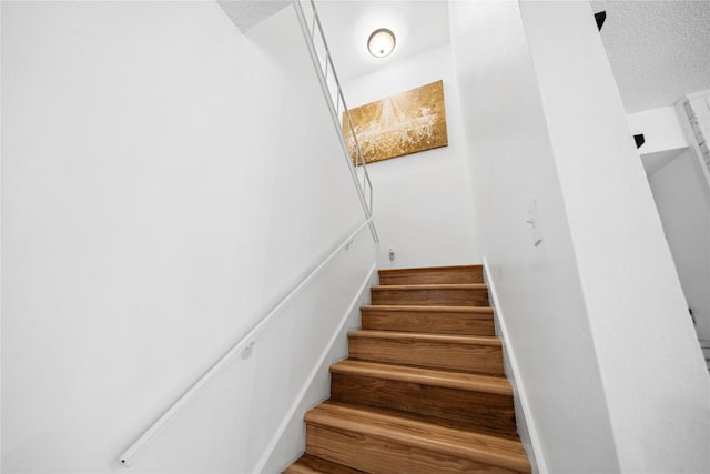 7162 Chimney Cors Unit 7204, Austin, TX 78731 - stairs with a textured ceiling