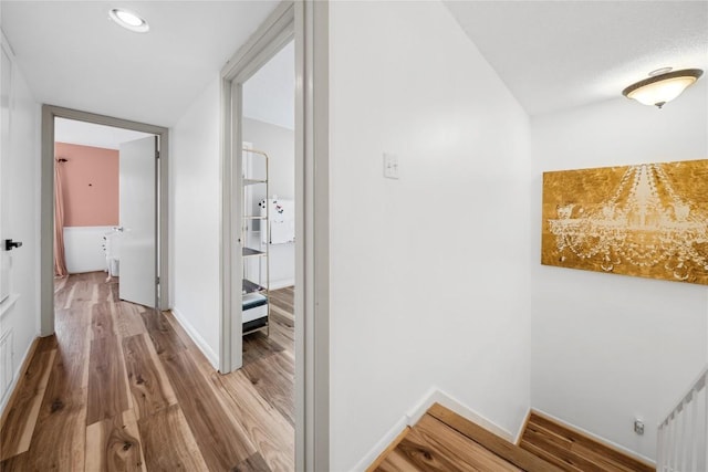 7162 Chimney Cors Unit 7204, Austin, TX 78731 - hallway with light wood-type flooring and recessed lighting