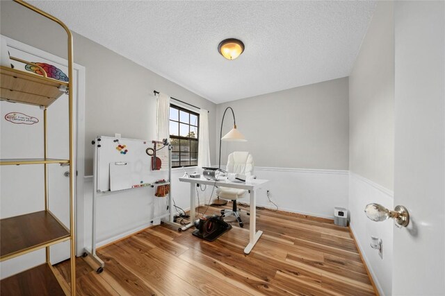 7162 Chimney Cors Unit 7204, Austin, TX 78731 - unfurnished office with wood finished floors and a textured ceiling