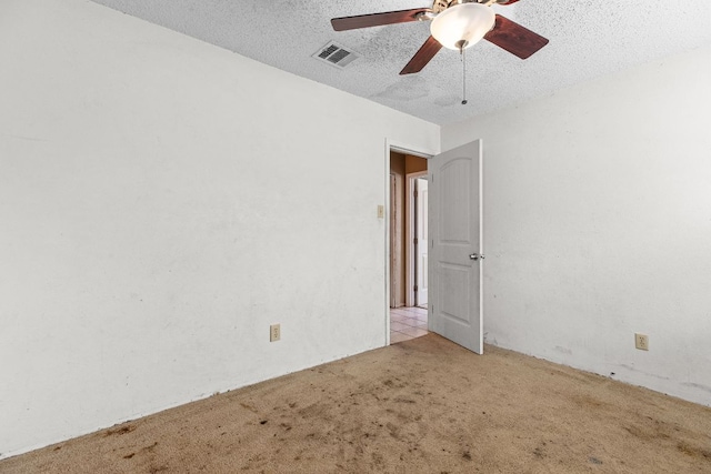 1703 Greyson Dr, Round Rock, TX 78664 - empty room featuring carpet flooring, ceiling fan, and a textured ceiling