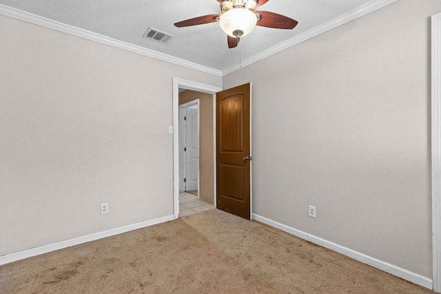 1703 Greyson Dr, Round Rock, TX 78664 - spare room with light colored carpet, ornamental molding, and a ceiling fan