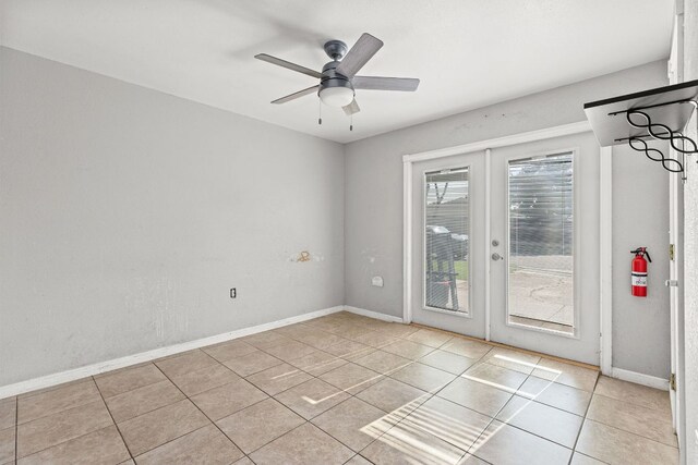 1703 Greyson Dr, Round Rock, TX 78664 - empty room featuring french doors, light tile patterned flooring, and ceiling fan