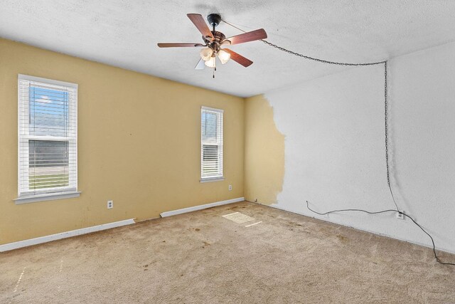 1703 Greyson Dr, Round Rock, TX 78664 - carpeted empty room featuring a textured ceiling and a ceiling fan