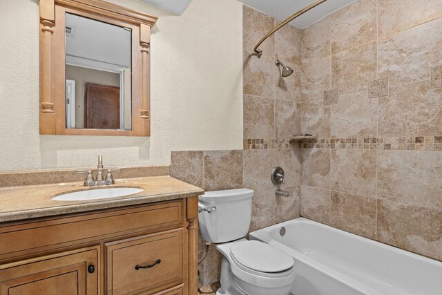 1703 Greyson Dr, Round Rock, TX 78664 - full bathroom with shower / tub combination, vanity, and a textured wall