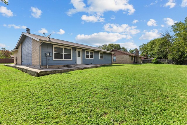 1703 Greyson Dr, Round Rock, TX 78664 - rear view of property featuring a chimney, a patio, and brick siding