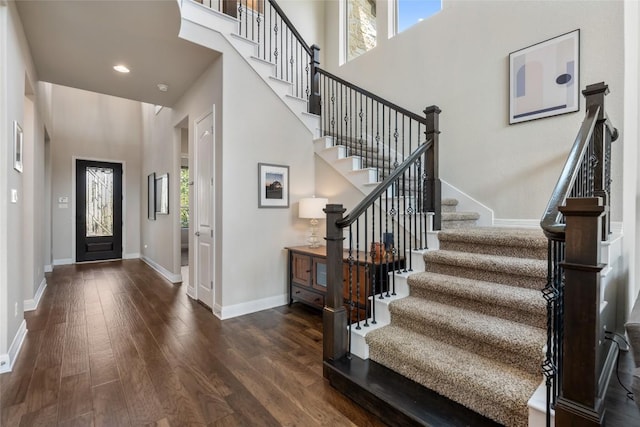 105 Curacao Ct, Austin, TX 78738 - foyer featuring stairs, wood finished floors, a towering ceiling, and recessed lighting