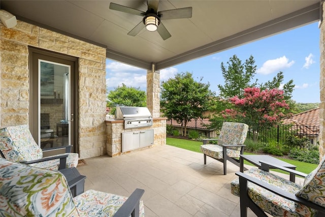 105 Curacao Ct, Austin, TX 78738 - fenced backyard featuring exterior kitchen, a patio area, and a ceiling fan