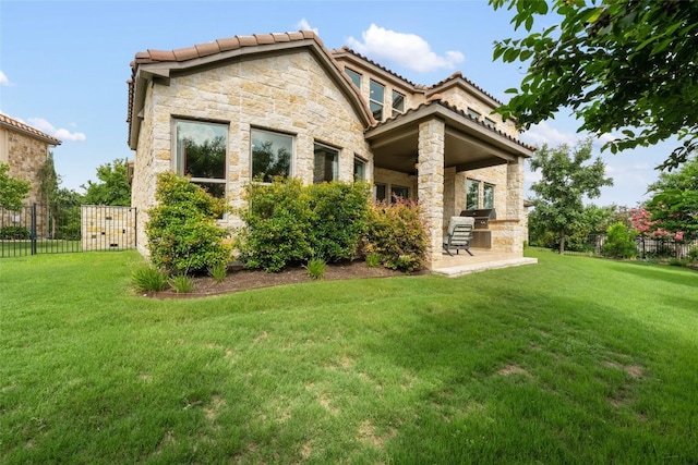 105 Curacao Ct, Austin, TX 78738 - back of property with stone siding, a tile roof, and a patio area