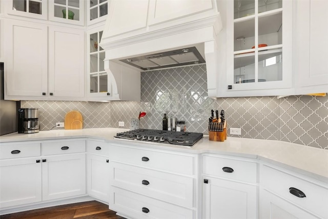 105 Curacao Ct, Austin, TX 78738 - kitchen featuring stainless steel gas stovetop, light countertops, decorative backsplash, and white cabinets