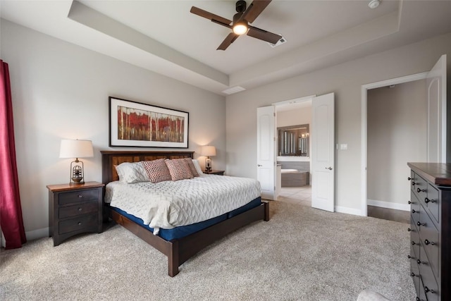 105 Curacao Ct, Austin, TX 78738 - bedroom featuring a raised ceiling, carpet, ensuite bath, and ceiling fan