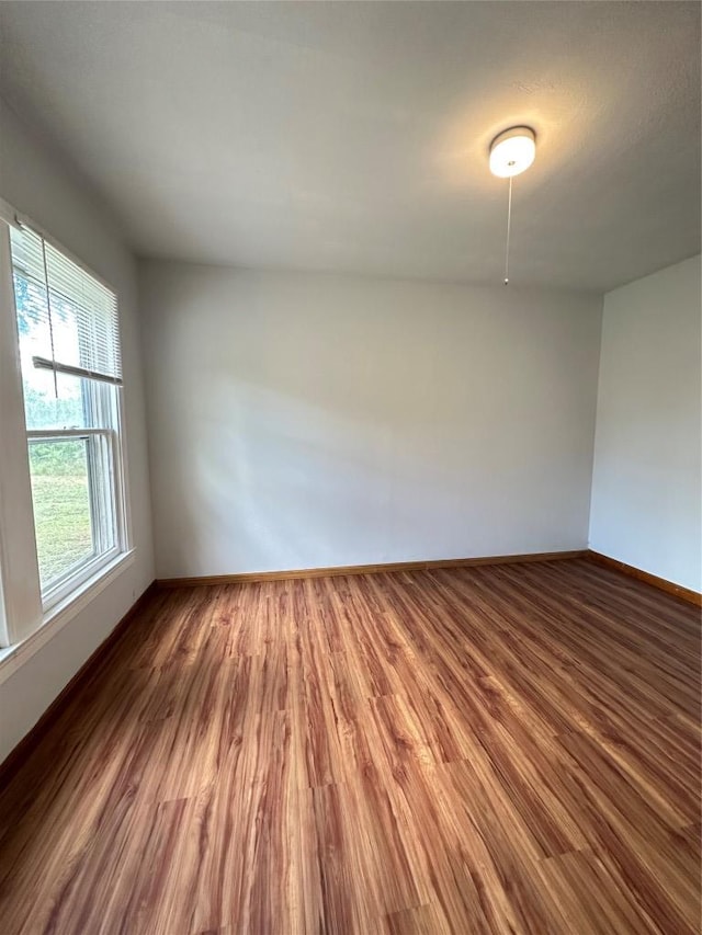 121 Wyers Pl, Cedar Creek, TX 78612 - spare room featuring wood finished floors and baseboards