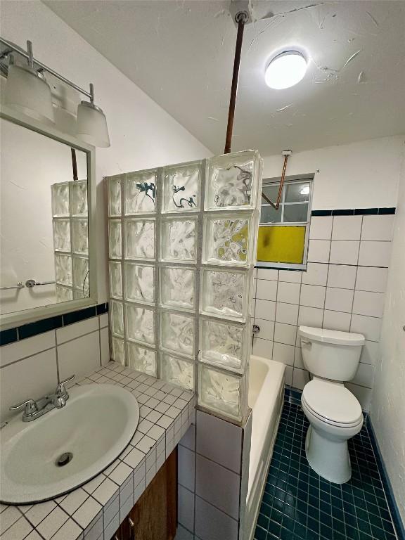 121 Wyers Pl, Cedar Creek, TX 78612 - full bathroom with tile walls, tile patterned flooring, and vanity