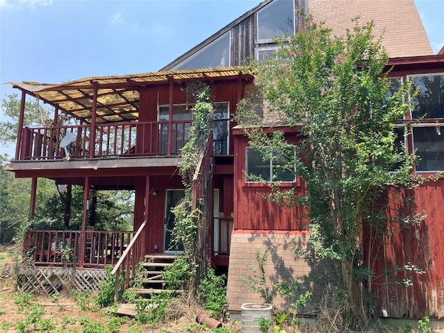 693 Saint Marys Rd, Rosanky, TX 78953 - rear view of house featuring brick siding and a wooden deck