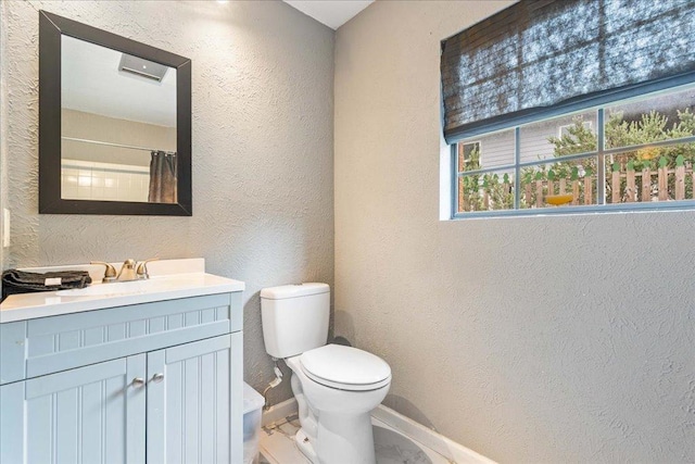 3704 Austin Cv, Lago Vista, TX 78645 - full bathroom with a textured wall, vanity, and marble finish flooring