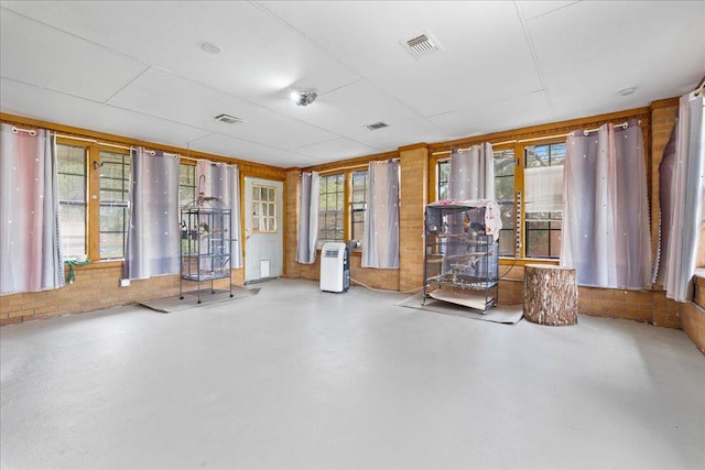 3704 Austin Cv, Lago Vista, TX 78645 - empty room with finished concrete flooring and plenty of natural light