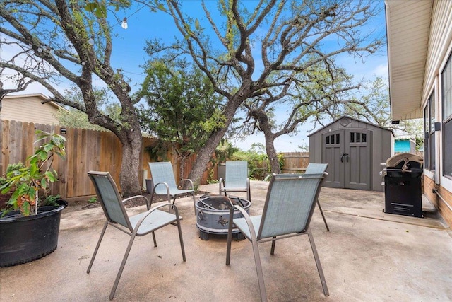3704 Austin Cv, Lago Vista, TX 78645 - fenced backyard featuring a patio, a storage unit, a fire pit, and a grill