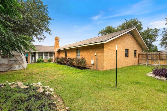 3704 Austin Cv, Lago Vista, TX 78645 - back of house featuring brick siding and a chimney