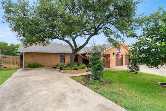 3704 Austin Cv, Lago Vista, TX 78645 - single story home featuring driveway, brick siding, and a garage