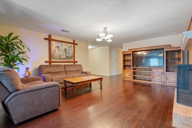 3704 Austin Cv, Lago Vista, TX 78645 - living room with a chandelier and hardwood / wood-style flooring