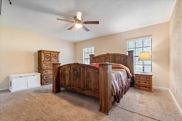 3704 Austin Cv, Lago Vista, TX 78645 - bedroom featuring light carpet, multiple windows, and a ceiling fan