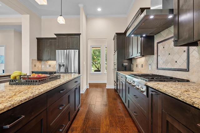 343 Covered Wagon Way, Driftwood, TX 78619 - kitchen with stainless steel appliances, wall chimney range hood, dark brown cabinets, light stone countertops, and dark wood-style floors
