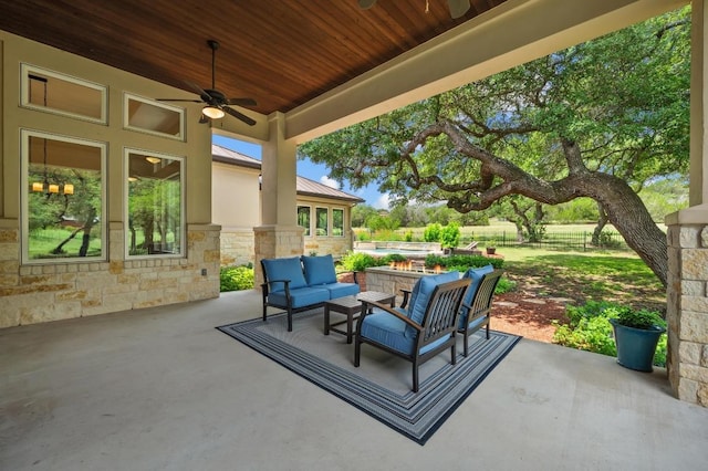343 Covered Wagon Way, Driftwood, TX 78619 - view of patio / terrace featuring ceiling fan and an outdoor living space with a fire pit