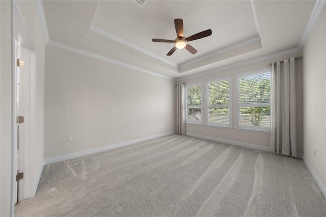 14 Acacia Way, Georgetown, TX 78633 - spare room with a tray ceiling, light carpet, a ceiling fan, and ornamental molding