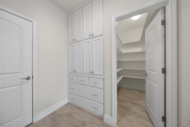 14 Acacia Way, Georgetown, TX 78633 - walk in closet with light tile patterned flooring
