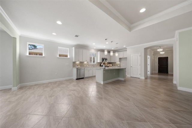 14 Acacia Way, Georgetown, TX 78633 - unfurnished living room with crown molding, arched walkways, recessed lighting, and light tile patterned flooring