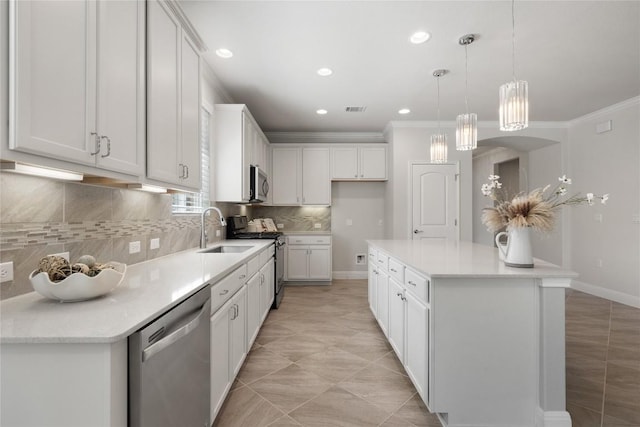14 Acacia Way, Georgetown, TX 78633 - kitchen with appliances with stainless steel finishes, crown molding, white cabinetry, tasteful backsplash, and light countertops